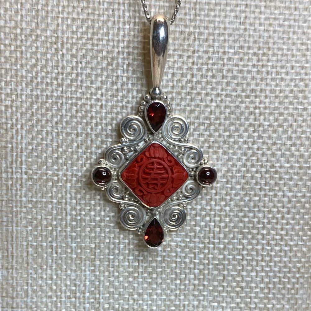 Vintage Signed Sajen 925 Sterling Carved
Cinnabar Pendant With Garnet Stones
